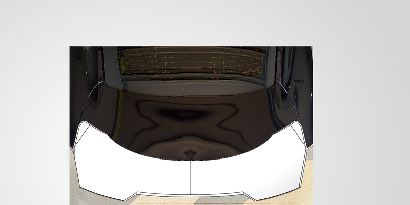 SolidWorks duckbill spoiler surface model positioned on a 3D scan of the Camaro trunk lid