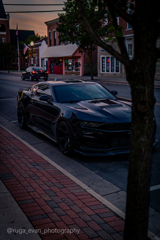 Black Camaro at dusk