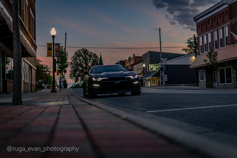 Black Camaro at dusk