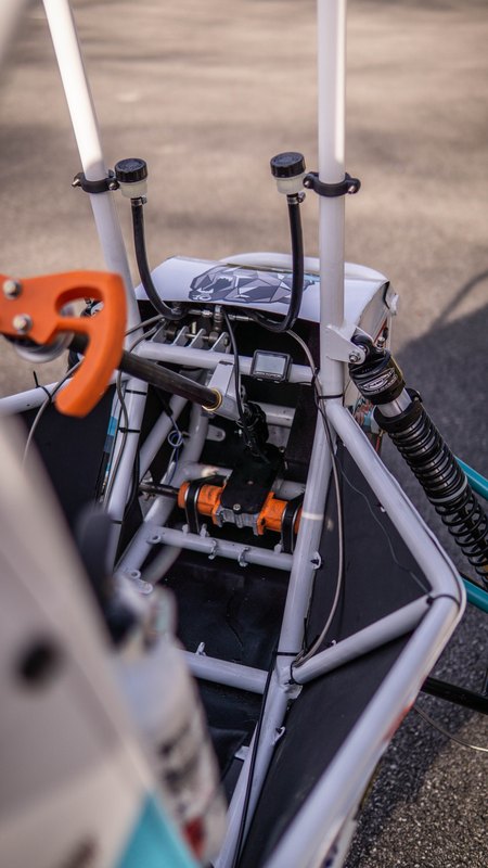 ONU Baja SAE car number 32, white bodywork and teal frame, at its reveal shoot