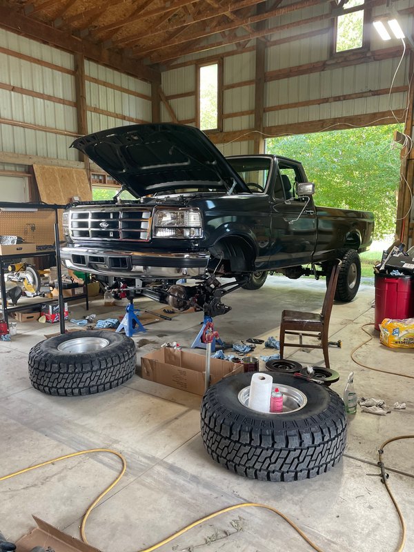 Front suspension work in the shop, wheels off, Jul 7, 2023