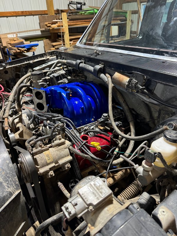 Engine bay with the blue part installed, Jun 28, 2024