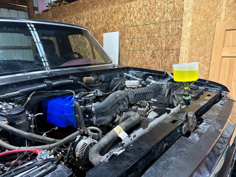 Engine bay reassembly, coolant funnel on the radiator, Jun 28, 2024