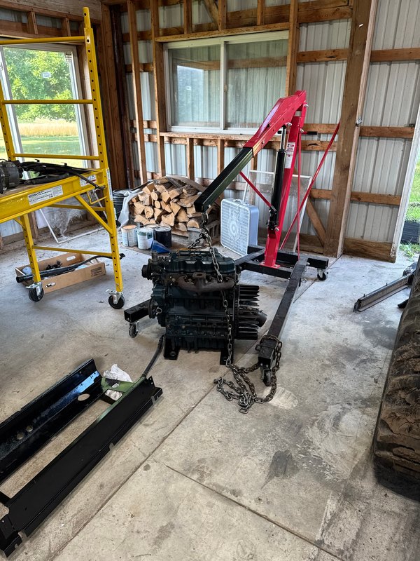 Engine on the hoist for reinstallation, Aug 1, 2025